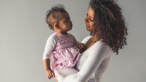 women holding baby toddler