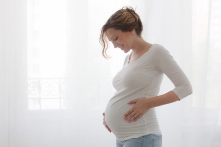 Pregnant woman touchingbelly