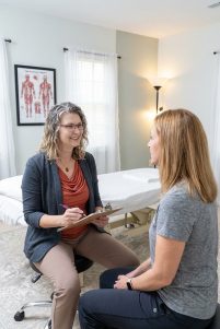Patient working with a provider at a pelvic floor physical therapy clinic in Leesburg, VA